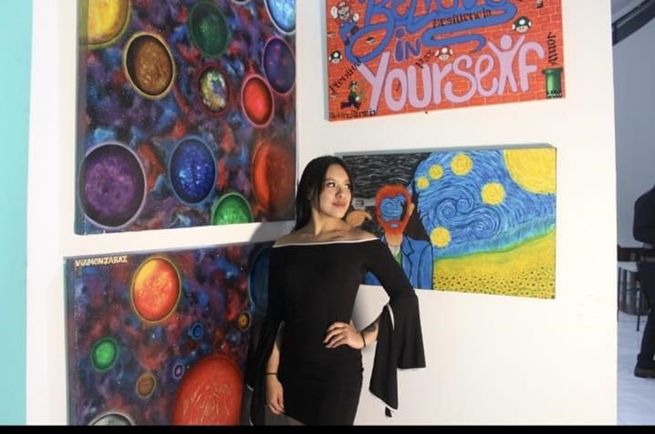 Exposición de pinturas cósmicas y pieza tipográfica